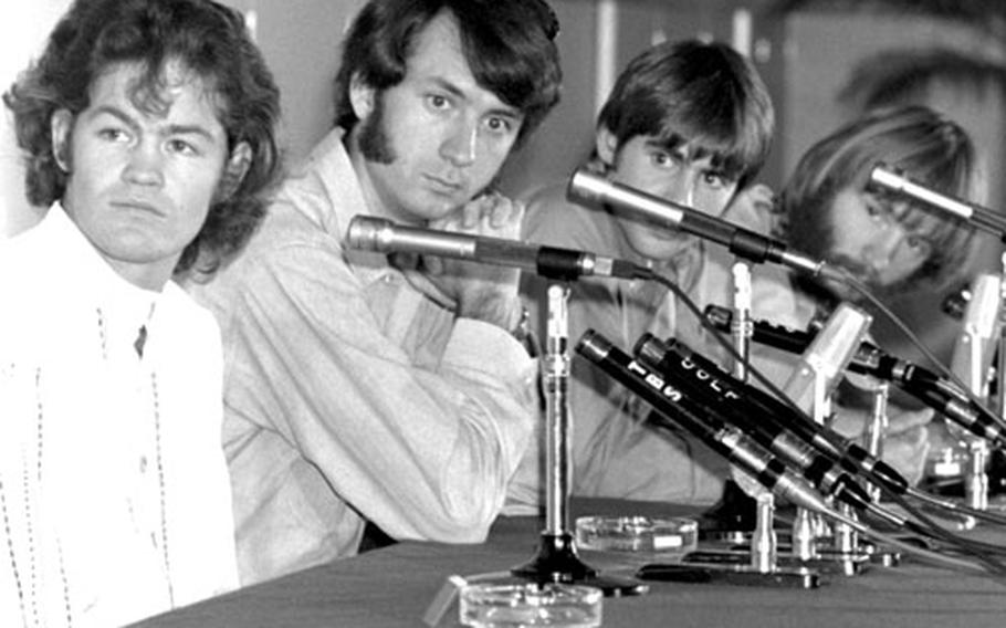 The Monkees listen to a question at a Tokyo press conference in 1968. Left to right, Mickey Dolenz, Mike Nesmith, Davy Jones, Peter Tork.