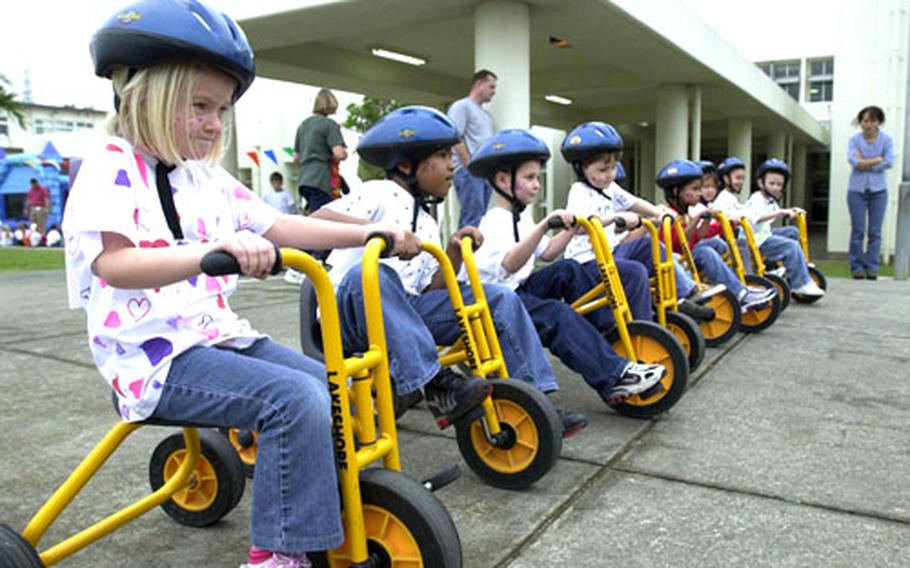 Kindergarten students at Bob Hope Primary School on Kadena Air Base line up and prepare to race 100 feet as they celebrated the 100th day of school Friday.