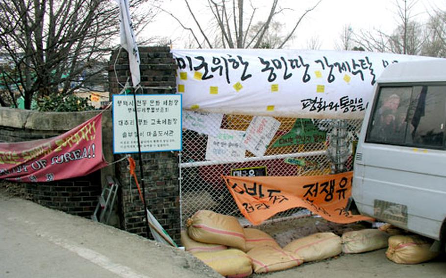 The school’s barricaded gate is just yards from the Camp Humphreys perimeter.