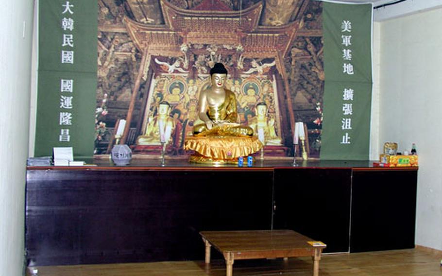 Inside the school, a room is set up as a Buddhist place of worship. Residents of the surrounding Daechu-ri farming village are using the room while barricaded inside the compound.