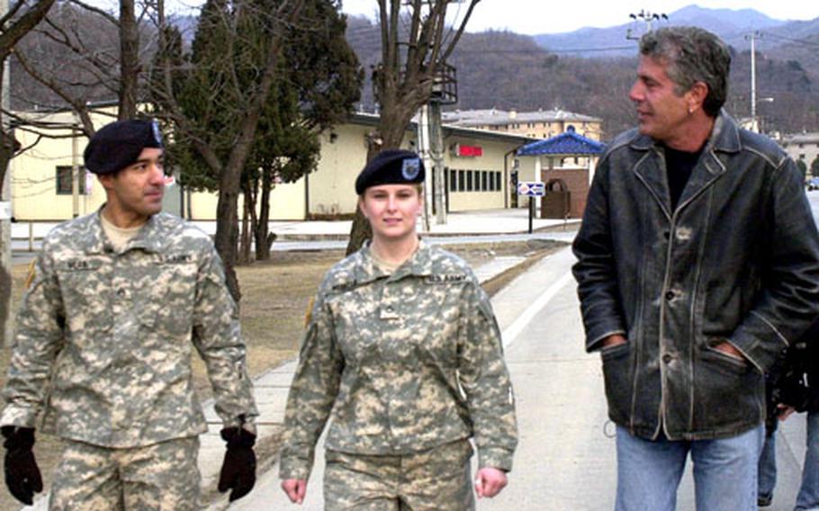 Sgt. Luciano Vera, left and Pfc. Amanda Merfeld talk with chef and best-selling author Anthony Bourdain while filming for the television show, “Anthony Bourdain: No Reservations.” The show will air on the Travel Channel in the U.S. in June, and later on Discovery Channel Asia.