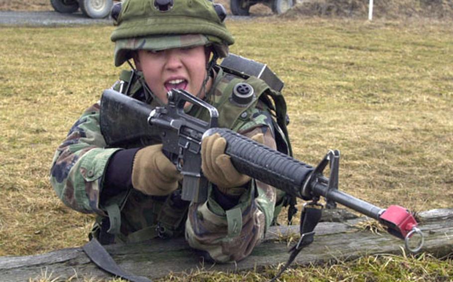 A soldier from the 141st Signal Battalion’s Company C fires blanks during convoy training at Grafenwöhr on Thursday. Under a change in Army tactics, soldiers who come under attack while on a convoy, will now stand and fight the enemy instead of shooting and pressing on.