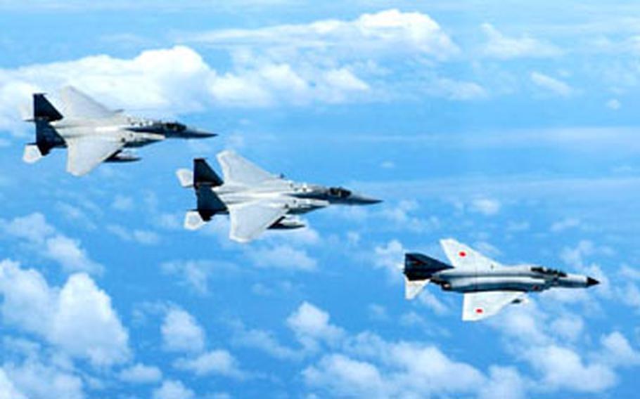 An Air Force investigation failed to detect the cause of an engine failure that caused an F-15 jet fighter, like the two pictured here with a Japan Air Self Defense Force F-4, to crash Jan. 17 in waters off Okinawa.