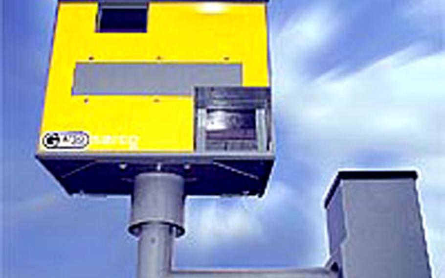 A fixed safety camera waits for its next victim. Thousands of safety cameras are emplaced throughout the UK to ensure safer roads by checking speeders.