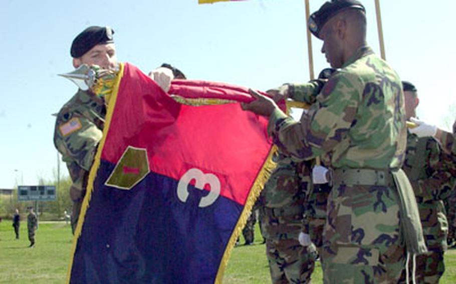 Lt. Col. Michael A. Todd, commander of the 3rd Brigade, 1st Infantry Division, left, and Command Sgt. Maj. Gregory L. Baugh case the brigade colors at Vilseck on Wednesday. The unit’s colors flew for the last time at Vilseck on Wednesday. The brigade is inactivating, but will reactivate as a light brigade combat team in Fort Knox, Ky.