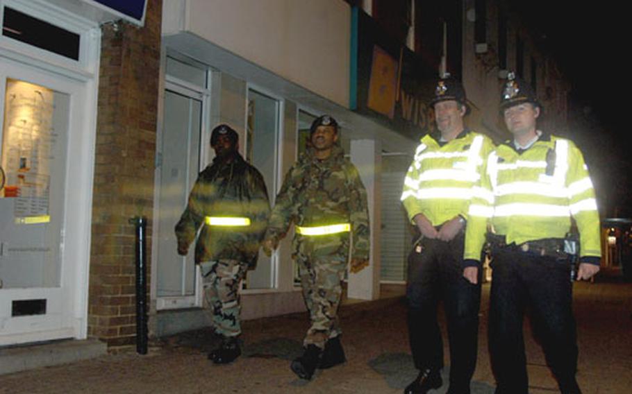 From left, Sgt. Darrell Richards and Tech. Sgt. Mario White, both from the 48th Security Forces Squadron, walk the streets of Newmarket with Suffolk County Constables Kevin Green and Dave Basham. The four were participating in a weekly joint patrol between the security forces at RAF Lakenheath and the Suffolk Constabulary.