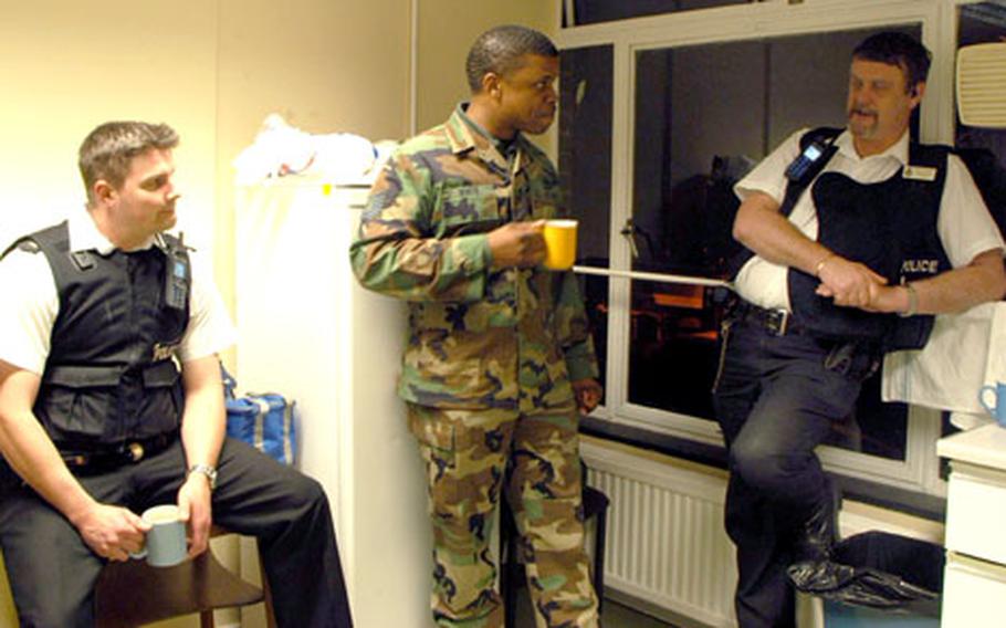 Basham, left, and White listen to Green while the three enjoy a cup of tea. “We’ve learned a lot about our surroundings, working with” the Suffolk police, White said.