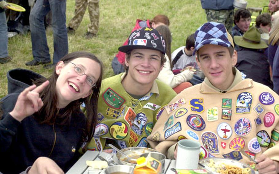 German Scouts participating in Intercamp 2006 enjoy an outdoor meal at Vilseck Army Airfield on Sunday.