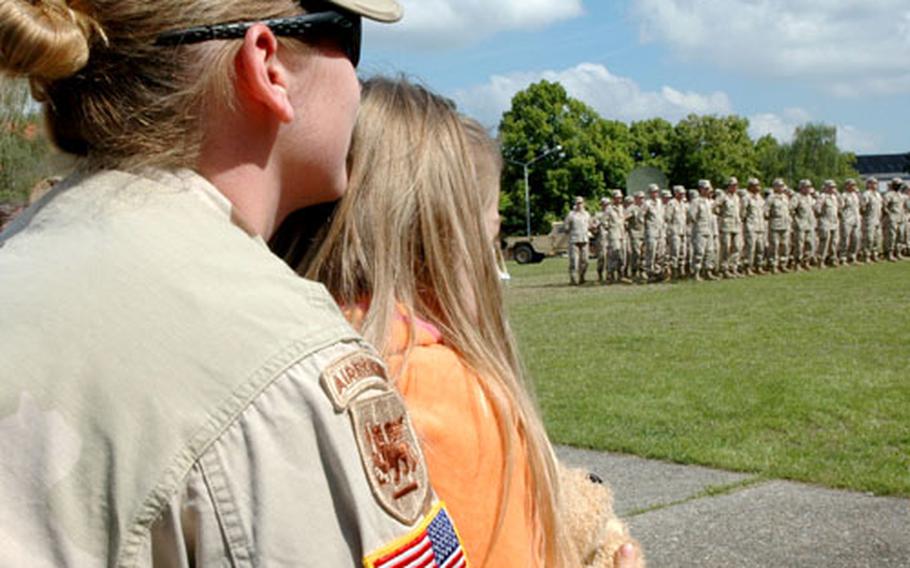 Robin Hoecker / S&S Cierra Norman, 5, sits on the lap of Sgt. Ashley Jarrell as they welcome back Cierra’s father, Staff Sgt. Andrew Norman, and the other members of the 165th Military Intelligence Battalion from a tour of duty in Afghanistan.