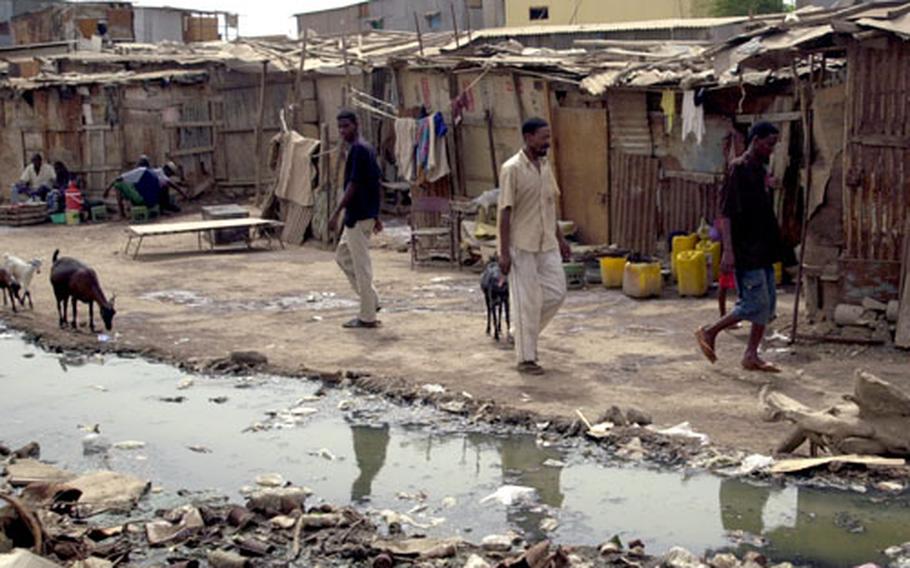 Sewage spills into the unpaved streets of the Djibouti City slum known as Arhiba.