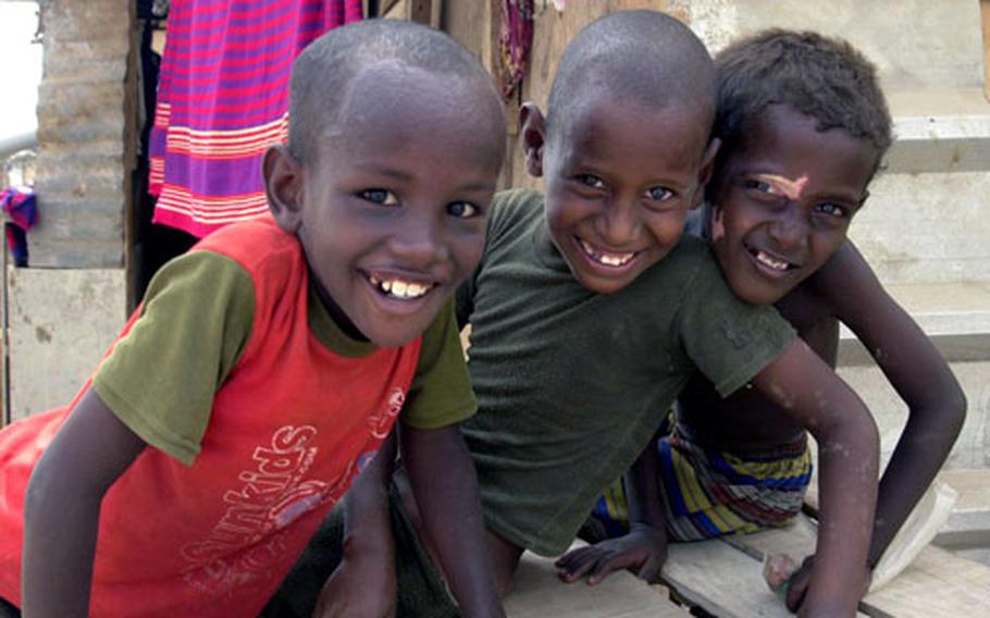 Young boys smile for the camera in the Djibouti City slum of Arhiba, home to an estimated 20,000 people. The slum is an example of places where extremists preach and recruit, U.S. officials say.