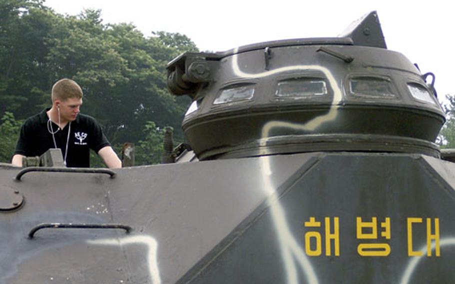 A 2nd Infantry Division soldier checks out a Korean War-era war machine Friday at the Freedom Protection Peace Museum at the foot of Mount Soyo. The soldiers were part of a Dongducheon city-sponsored tour, the first of its kind in six years.