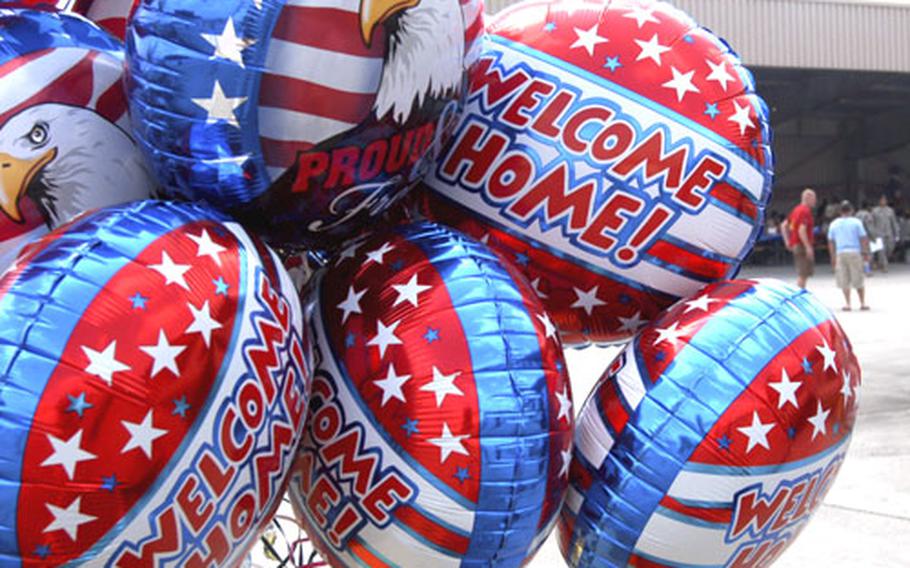 Balloons fly at the welcome home celebration for the 77th Maintenance Company at Babenhausen Kaserne, Germany on Thursday.