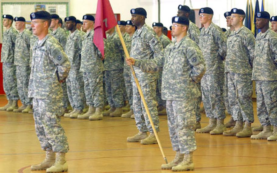 The colors of the 77th Maintenance Company are again flying in Babenhausen, Germany, after they were uncased at the unit&#39;s official welcome home ceremony on Thursday. The 77th, commanded by Capt. Alex Hunt, left, returned from Operation Iraqi Freedom in April. Holding the colors is Spc. John Weiss.