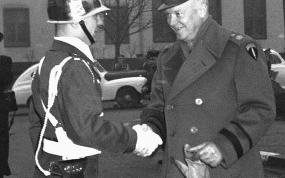 Gen. Dwight D. Eisenhower shakes hands with the 18th Infantry Regiment honor guard's commander, Lt. John W. Lauterbach, Jr., at the 1st Infantry Division's headquarters in Darmstadt, Germany, in 1951.