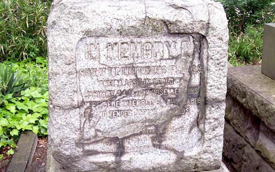 Time and the elements have nearly erased the words inscribed on a memorial to the lost crew of the USS Oneida at Honmonji Temple near Tokyo.