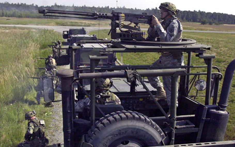 596th Maintenance Company soldier Spc. Anthony Barefoot, 23, of North Manchester, Ind., fires a .50 caliber machine gun at Grafenwohr on Thursday.