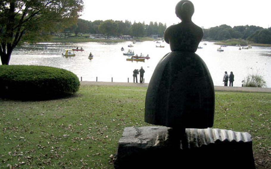 A sculpture looks over a lake crowded with boaters at Showa Kinen Park in Tachikawa, Japan, not far from Yokota Air Base. The park is on land that once was Tachikawa Air Base but was returned to Japan in November 1977.