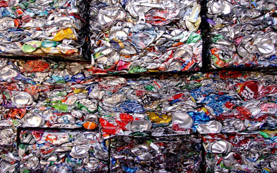 Aluminum and metal cans are crushed into cubes at the Recycling and Incinerator Plant on Yokota Air Base, Japan. In 2005, the facility handled more than 9,000 tons of waste generated by base servicemembers, civilians and their families.