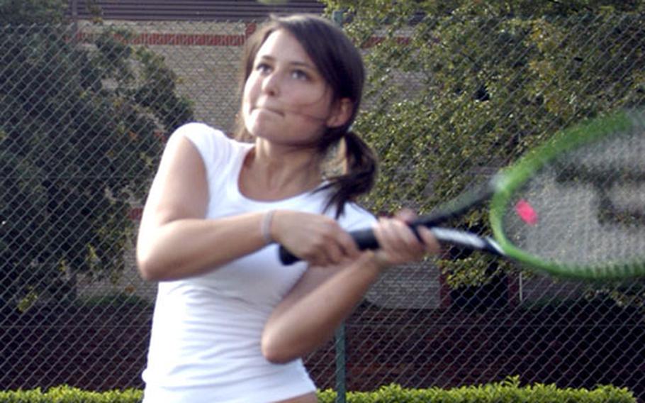 Senior Jenna Harris take a swing during tennis practice at Lakenheath High School.