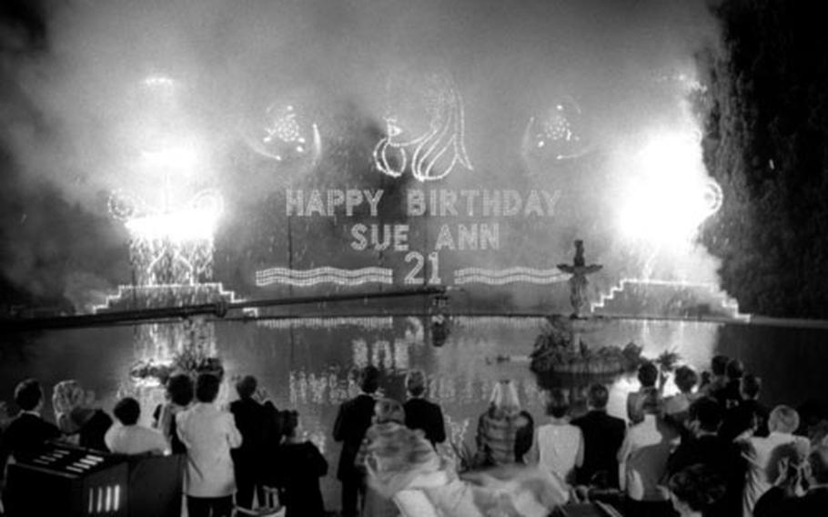 Birthday greetings for Sue Ann Daley (played by Bergen) are presented in fireworks.