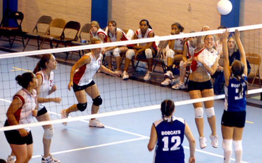 Lakenheath&#39;s Greta Gerstner spikes the ball against a leaping London Central defender at Saturday&#39;s All-England Volleyball Jamboree.