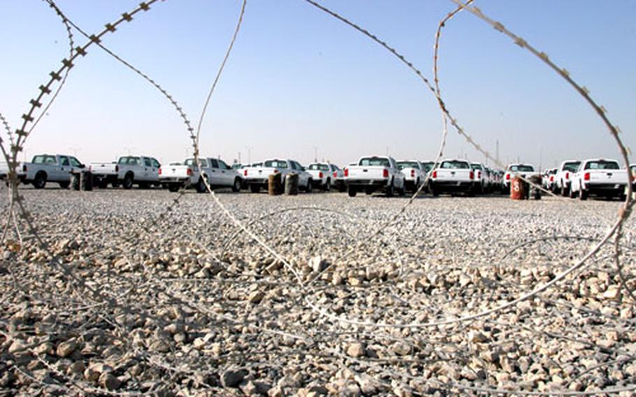 American-built pickup trucks destined for U.S. military units in Iraq and Iraqi police were temporarily stored last week at the Sea Port of Debarkation’s marshalling yards in Kuwait.