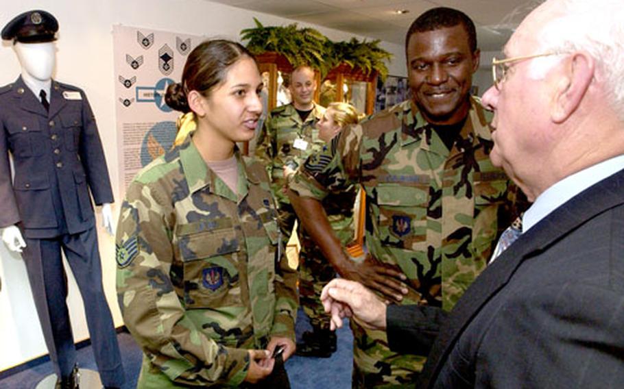 Staff Sgt. Melissa Leyba, a builder assigned to the 735th Civil Engineering Squadron, talks with retired Chief Master Sgt. Sam Parish, right, and USAFE Command Chief Master Sgt. Gary Coleman about the new Parish Enlisted Heritage Room. Leyba helped build the room, which is named after Parish.