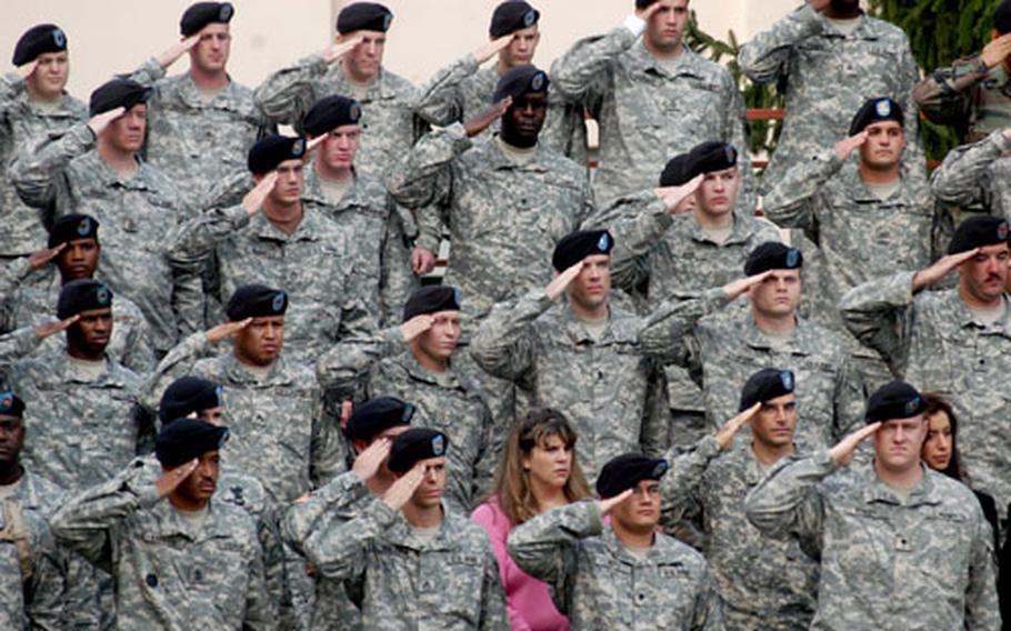 Soldiers of the 3rd Corps Support Command stand and salute during Thursday’s change of command ceremony in Wiesbaden, Germany.