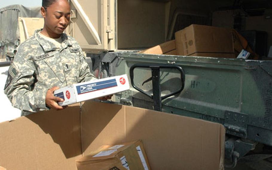 What’s in the box? Most care packages contain snacks, candy and hygiene items. But occasionally, they carry stranger fare. First Lt. Nicole Spears, 26, of Shreveport, La., examines a box as she picks up mail for her unit Thursday at Camp Victory.