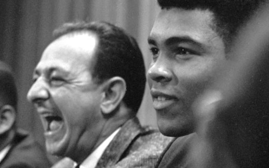Angelo Dundee with Muhammad Ali at a 196 press conference in Frankfurt, Germany.