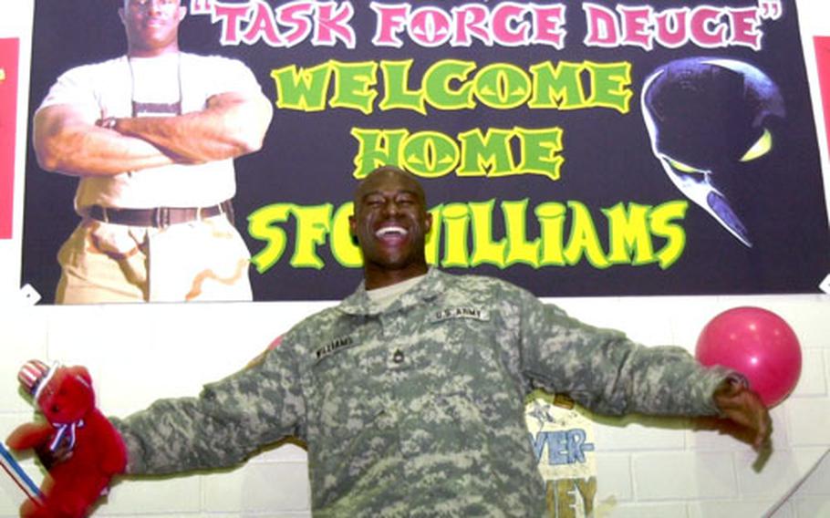 Sgt. 1st Class Dorian D. Williams of the 529th Ordnance Company shows his elation after arriving early Wednesday morning in Grafenwöhr, Germany, from Iraq.