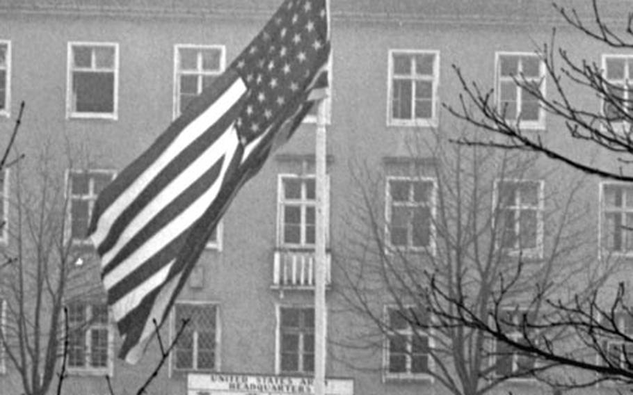 The flag is lowered to half-staff at a U.S. base in Darmstadt, Germany, following the death of President Kennedy.