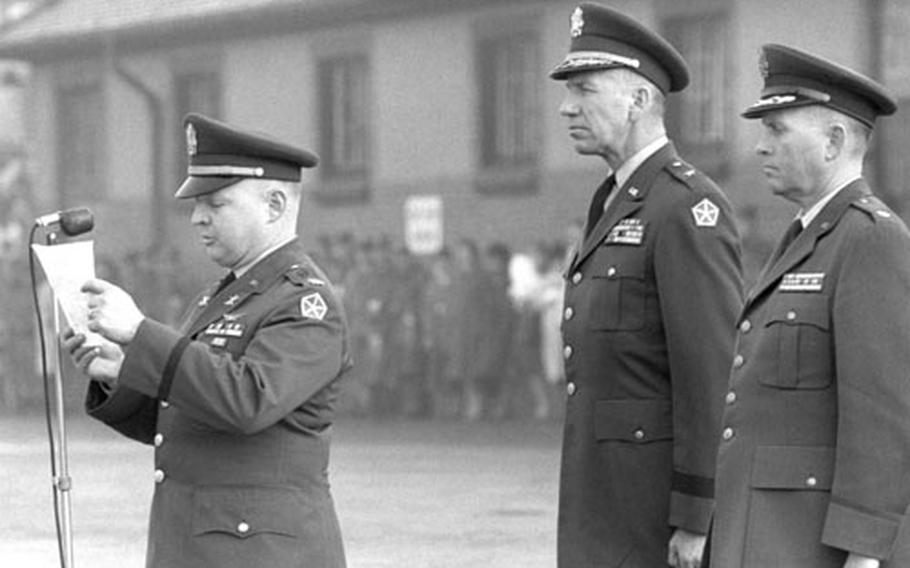 Secretary of Defense Robert S. McNamara's announcement of the death of President Kennedy is read during a troop assembly in Darmstadt, Germany.