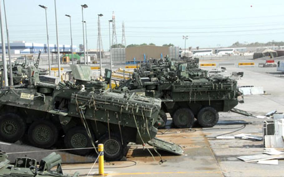 Some 172nd Strykers wait to be washed before going through customs and onto a ship back to Alaska. The vehicles have to be clean enough to pass a “pinch test,” meaning a customs agent can’t pinch any dirt between his fingers during inspection.