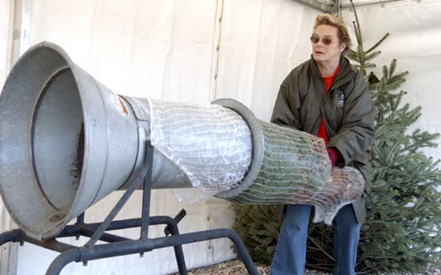 Rosemary Flack wraps up a Christmas tree for a customer at the Elveden Estate and Farm.