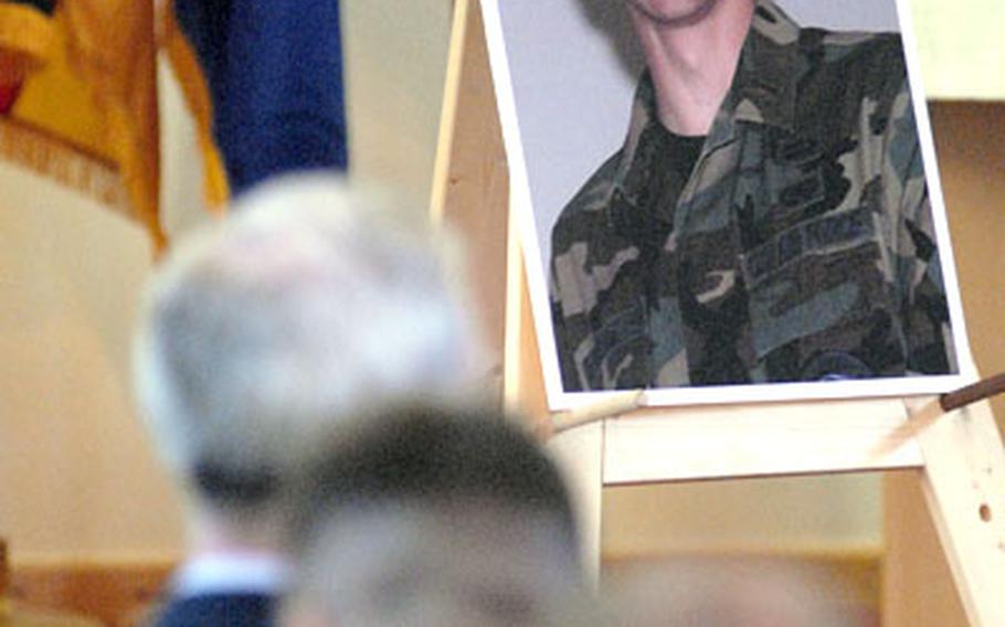 A photo of 1st Lt. Jamin Wilson is displayed at the front of the Spangdahlem Air Base chapel during a memorial service on Tuesday. Wilson, who served as a communications officer with the 52nd Communications Squadron, died in a car accident Dec. 14th when his car slide out of control on his way to work.