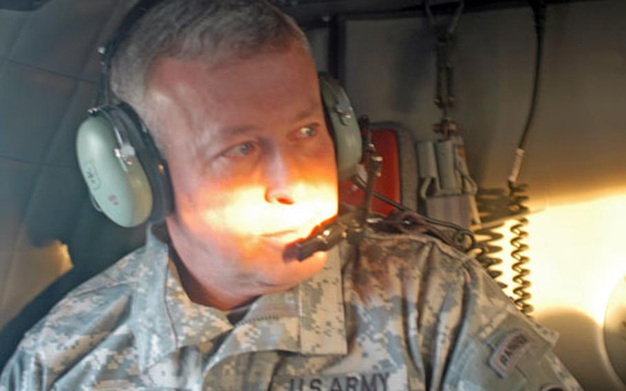 Gen. David McKiernan looks out of his Black Hawk helicopter during a trip to Hohenfels, Germany. McKiernan, who completed his first year as U.S. Army Europe commander, is charged with transforming the footprint of U.S. troops in Europe even as America continues to fight wars in Iraq and Afghanistan.