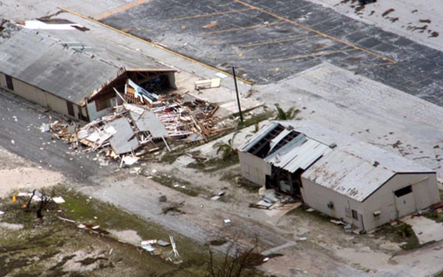 A photo taken over Wake Island during an aerial assessment by the Coast Guard after Typhoon Ioke shows badly-damaged buildings on the island.