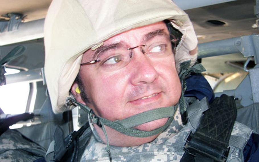 Brett Hardin, a 22-year employee of the Army and Air Force Exchange Service, gets a quick helicopter ride over the skies of Iraq. Until recently, he was the Main Street food court and theater manager on Camp Foster. As an AAFES employee, he arrived in Irag in October 2006 to work as chief of services.