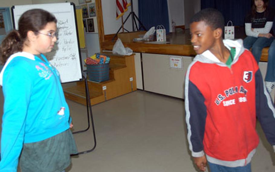 Sixth graders Anna Hovde and Robert Garrett role play during practice for an anti-bullying skit performed in December for all sixth-graders at Sollars Elementary School, Misawa Air Base, Japan. The school recently introduced a new program for sixth-graders designed to empower victims of incessant teasing or bullying.