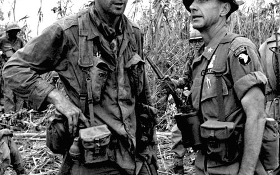 At Dak To after the battle, Capt. William Carpenter, left, talks with Brig. Gen. Willard Pearson, commander of the 1st Brigade, 101st Airborne Div.