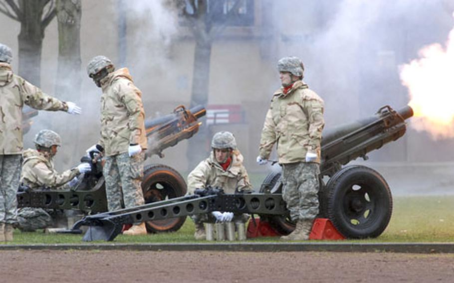 Soldiers of 1st Battalion, 94th Field Artillery, 1st Armored Division, fire salutes at the beginning of the assumption of command ceremony for incoming V Corps commander Lt. Gen. James Thurman.