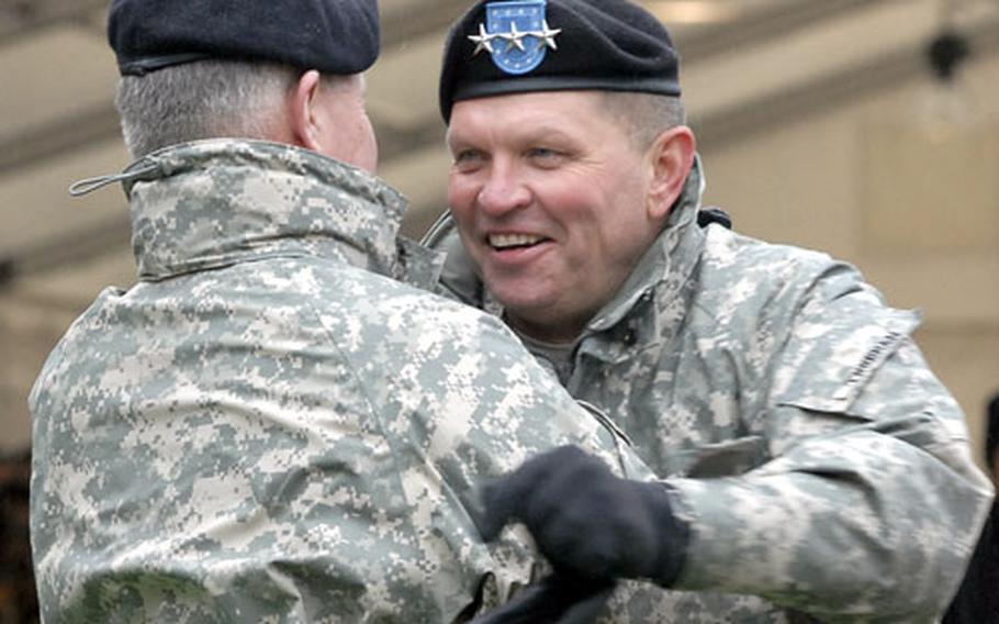 Lt. Gen. James Thurman, right, the incoming commander of V Corps, gets a hug and a handshake from U.S. Army Europe commander Gen. David McKiernan at the assumption of command ceremony for Thurman.