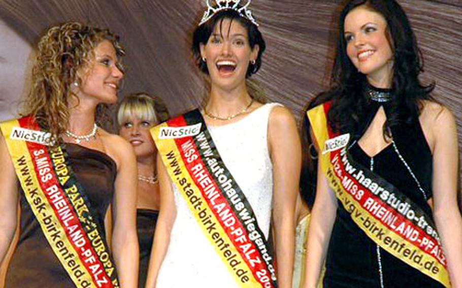 Christina Baralt, 19, center, who has been a bagger at the Vogelweh commissary in Kaiserslautern, Germany, will compete for the title of Miss Germany 2007 this weekend. Baralt’s father, Tony, is a retired Air Force colonel.