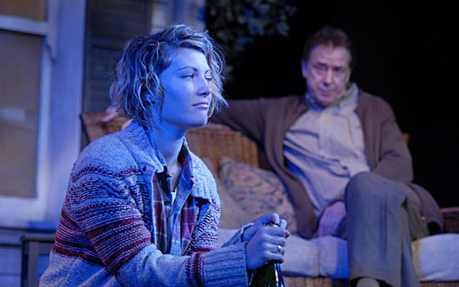 Sally Oliver, playing Catherine, and Terence Booth, who plays Robert, share a scene in "Proof." The American play is making another showing on London&#39;s West End through March 17 at the Arts Theatre London.