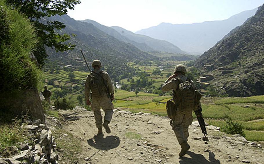 Marines with 2nd Battalion, 3rd Marine Regiment, patrol a dusty road in an eastern Afghanistan valley in October 2005. Following its Afghanistan deployment, the Marines out of Kaneohe Bay, Hawaii, are now serving in and around Haditha, Iraq.
