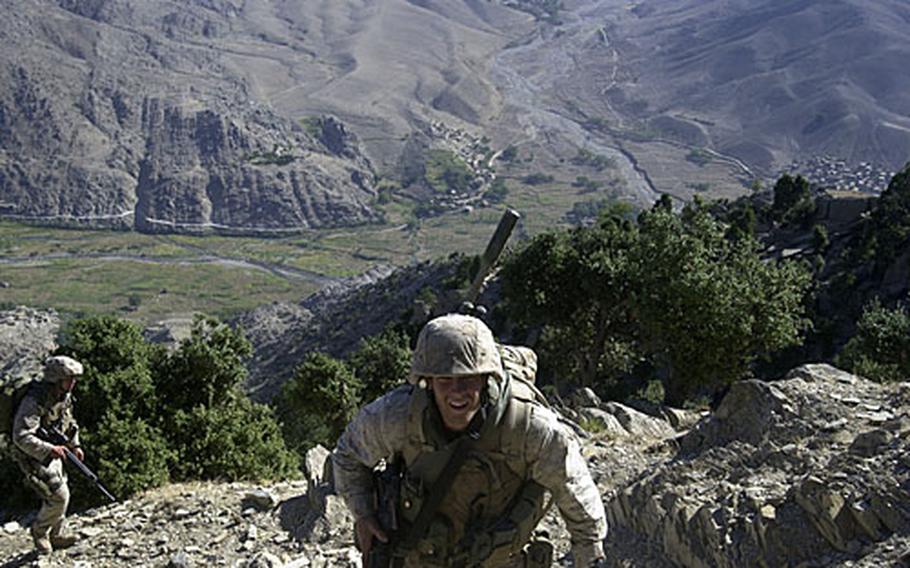 Marines with 2nd Battalion, 3rd Marine Regiment, scale a 7,000-foot mountain in eastern Afghanistan in September 2005.