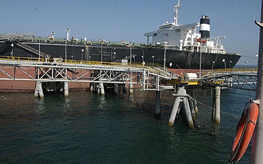 The oil tanker Tiara Monrovia takes on a load of roughly two million barrels of crude oil Wednesday from the Iraqi Al Basra Oil Terminal, one of two in the Persian Gulf protected by U.S., coalition and Iraqi navies. The terminals provide about 85 percent of Iraqi&#39;s revenue, and bring in some $11,000 a second.