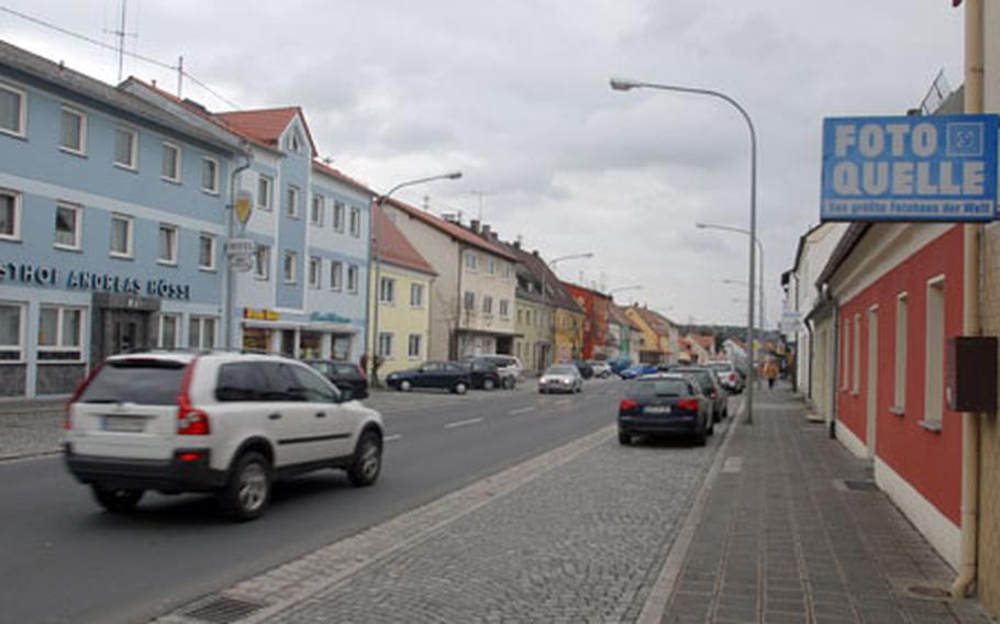 Local opinion is divided over plans for a bypass intended to divert American traffic around downtown Grafenwohr, Germany. At left is a restaurant run by Andreas Hossl, who thinks Americans won&#39;t generate as much traffic as people fear.